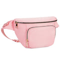 Pink waist bag with gold zippers on a white background