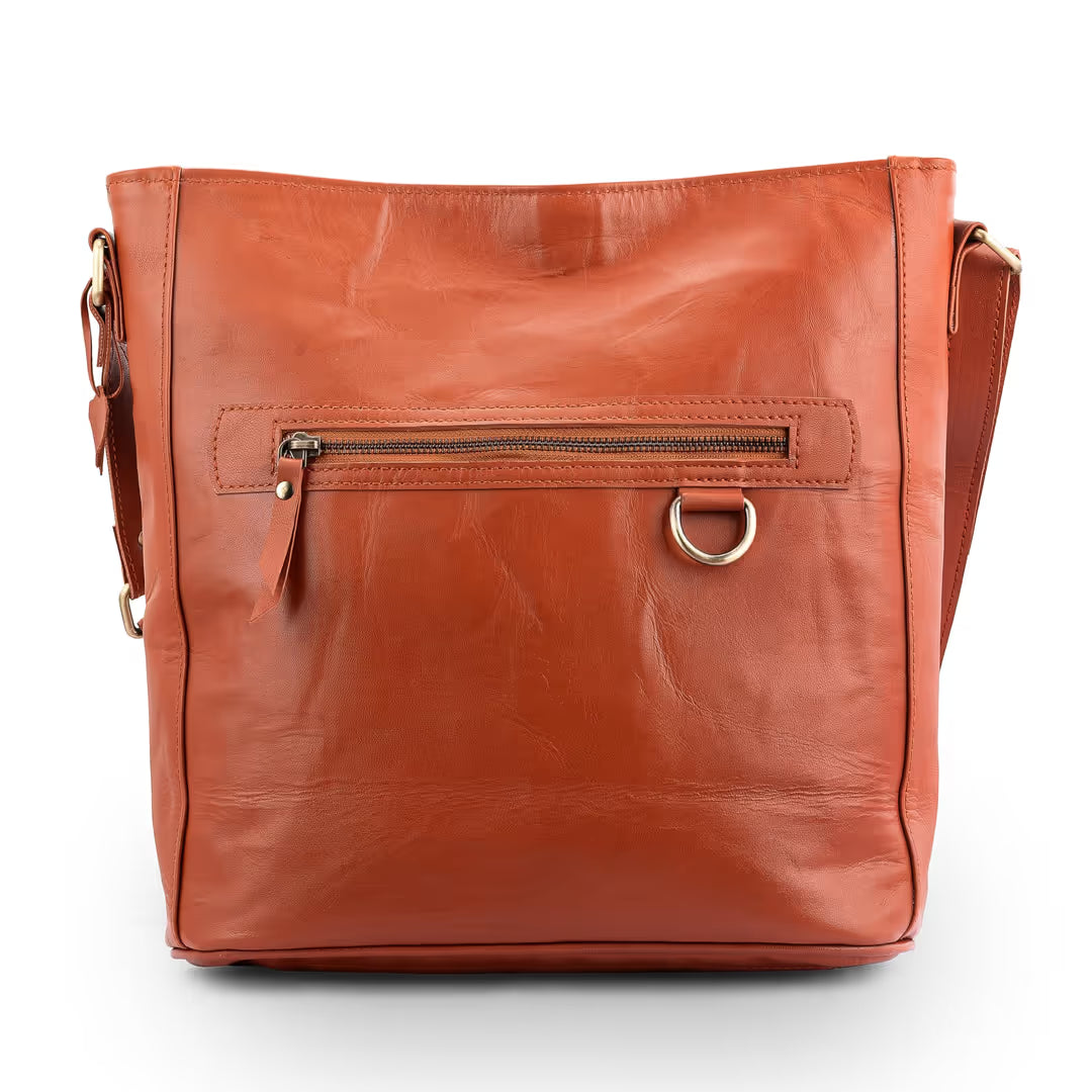 Brown leather handbag with a gold zipper and handle on a white background