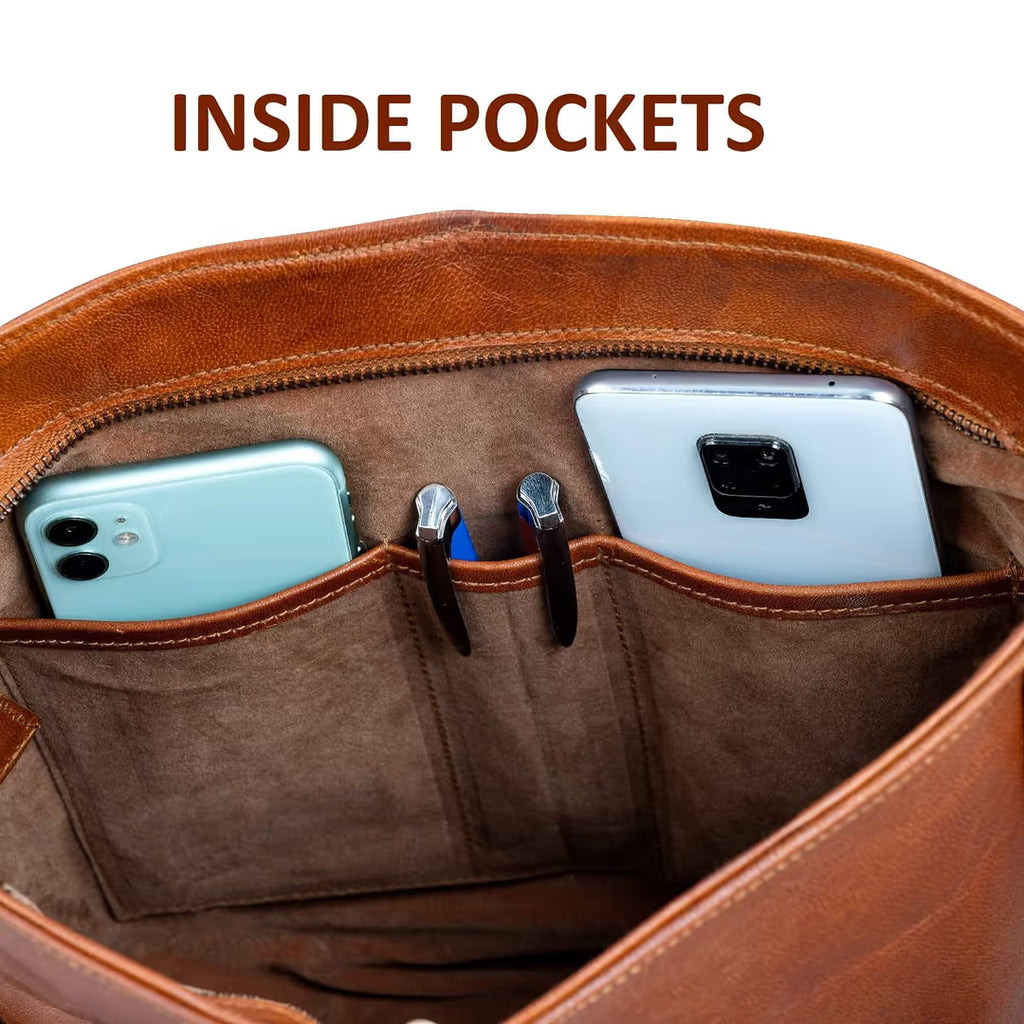 Brown leather bag with inside pockets holding two smartphones.