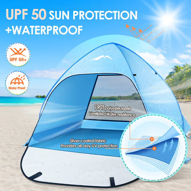 Pop-up beach tent with UPF 50+ sun protection and waterproof features on a sandy beach.