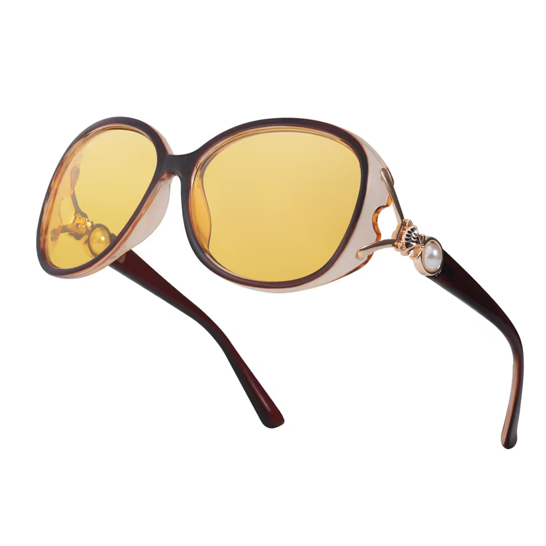 Oversized vintage style sunglasses with yellow lenses on a white background