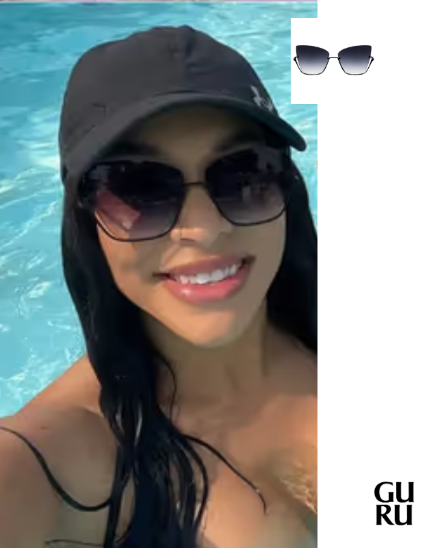 Woman wearing cat-eye rimless sunglasses in a swimming pool