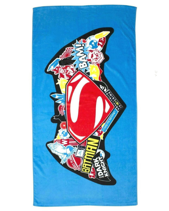 Superman vs Batman beach towel with colourful graphics on a blue background