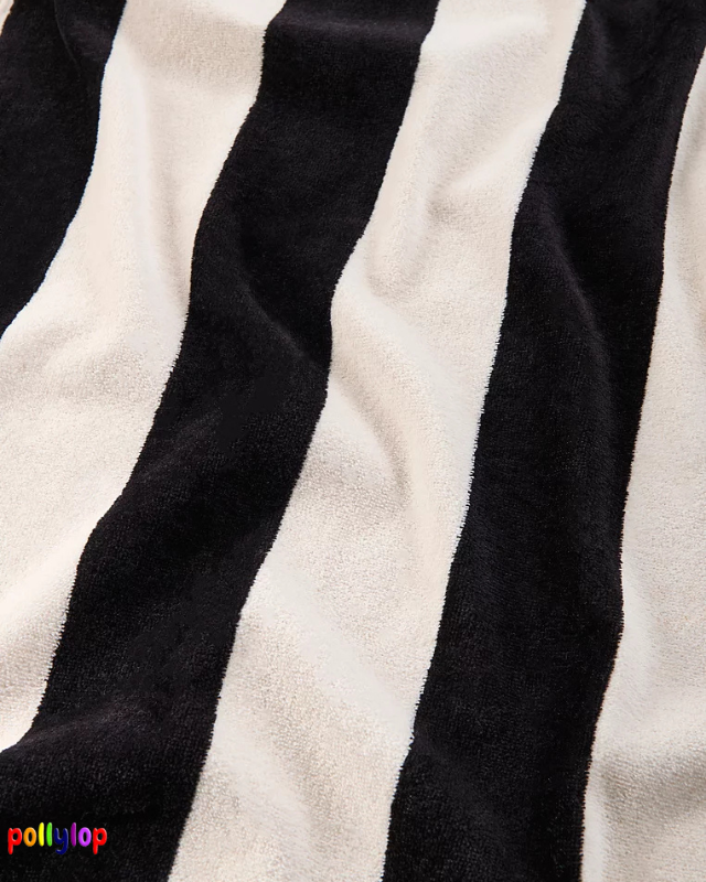 Black and white striped beach towel on white background