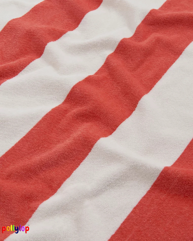Red and white striped beach towel on white background