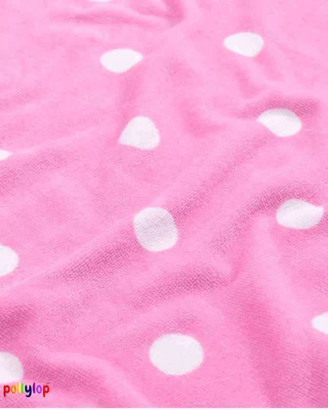 Pink polka dot beach towels on white background