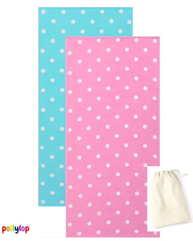 Pink and blue polka dot beach towels on white background