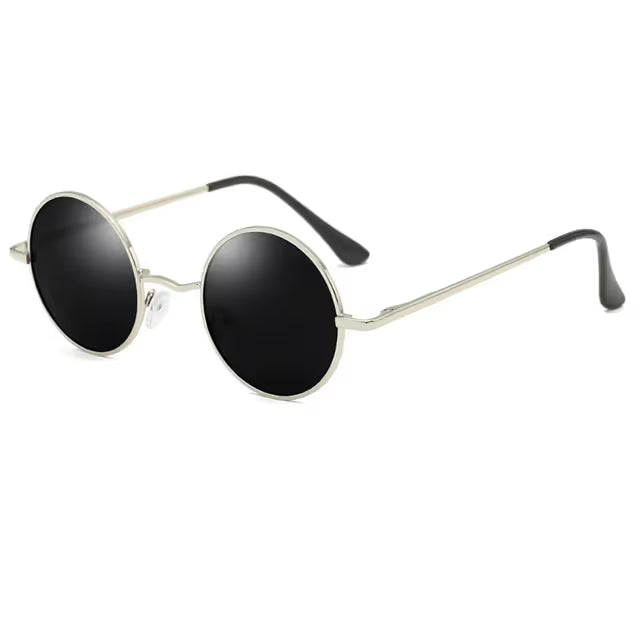 Round sunglasses with black lenses and silver frames on a white background