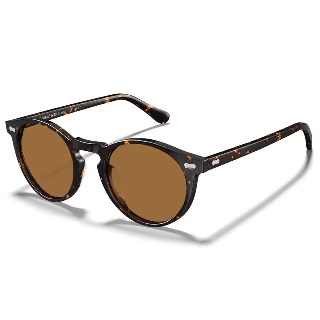 Sunglasses with brown lenses and tortoiseshell frame on a white background
