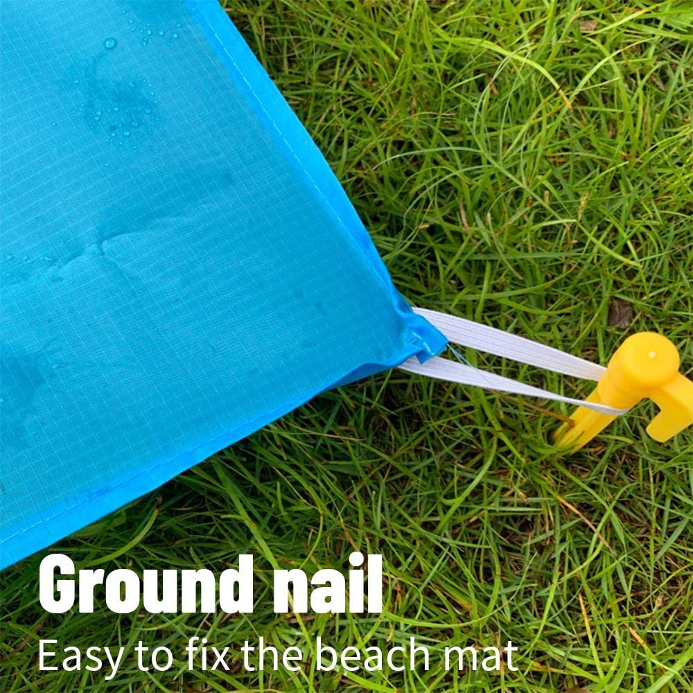 Blue beach mat with a yellow ground nail on grass, text 'Ground nail Easy to fix the beach mat'.
