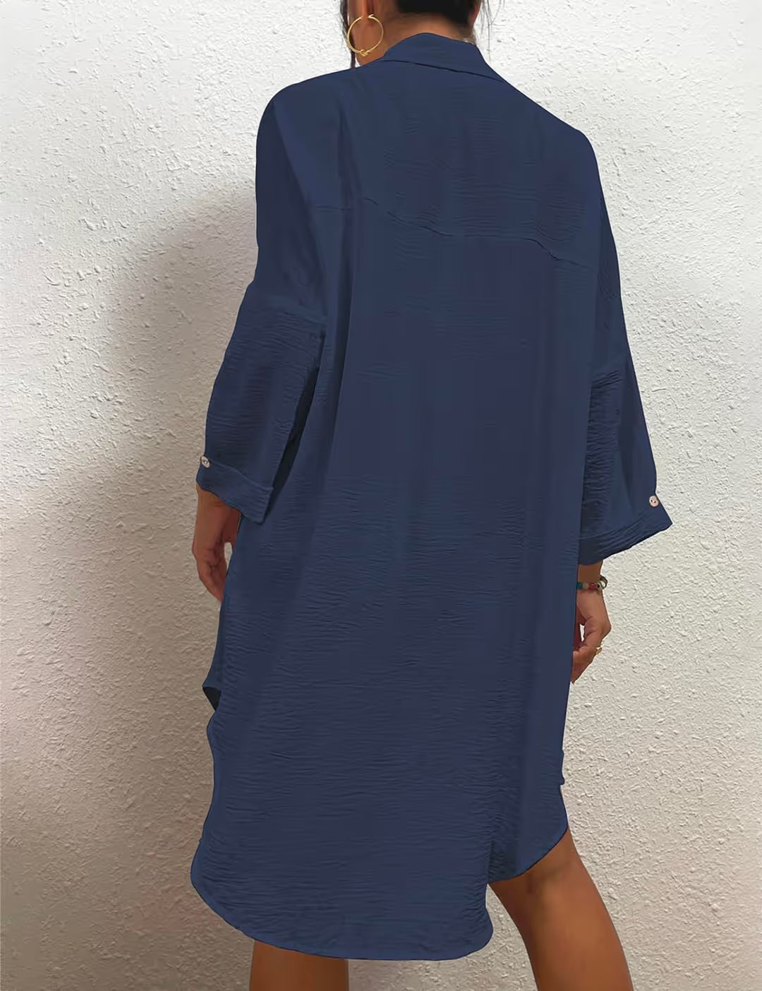 Woman in blue summer cover-up dress on white background