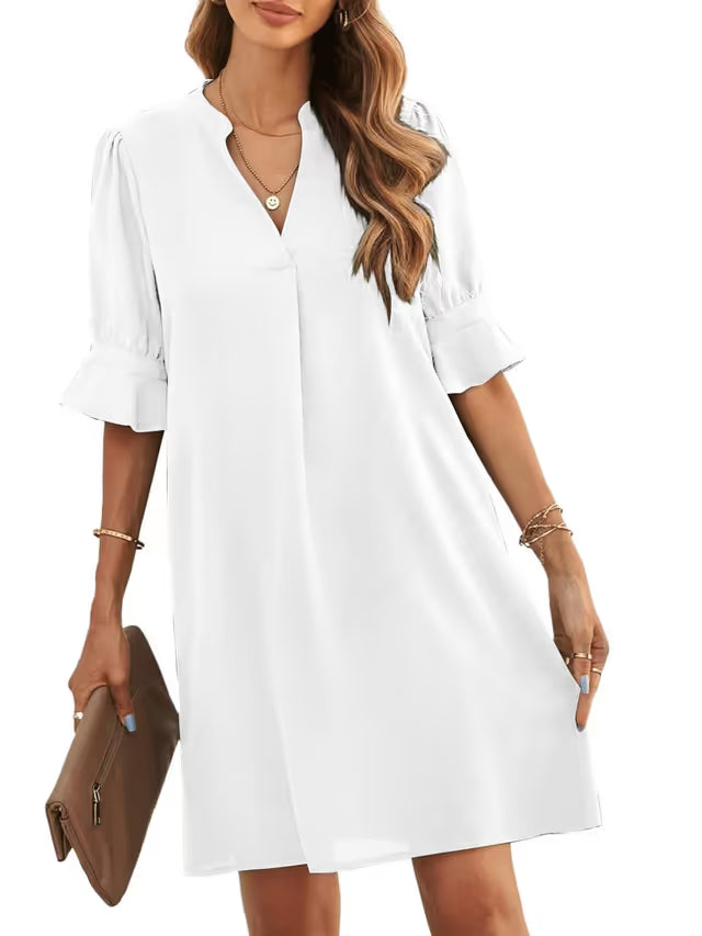 Woman in white cover-up dress on white background
