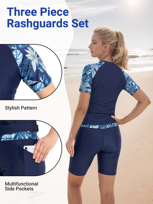 Woman wearing a three-piece rashguard set with floral pattern on a beach, highlighting stylish design and functional features.