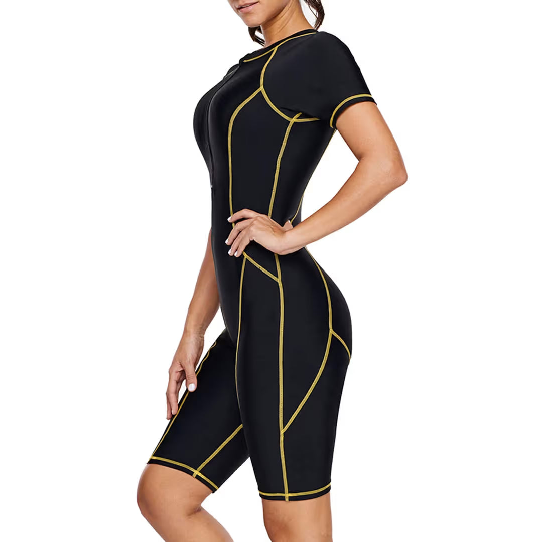 Black wetsuit with yellow accents worn by a model on a white background