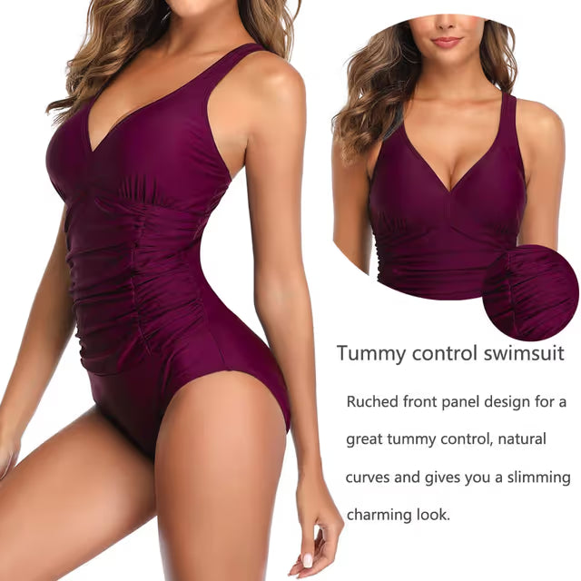 Purple swimsuit with criss-cross straps on a white background