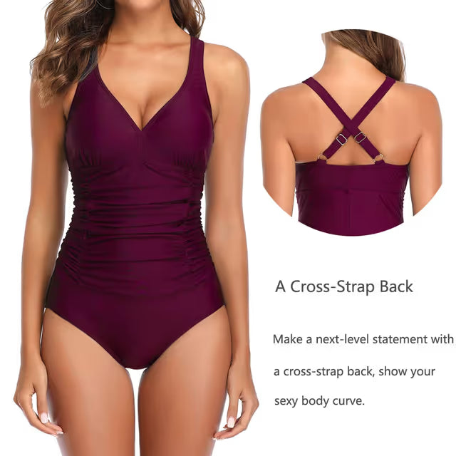 Purple swimsuit with criss-cross straps on a white background