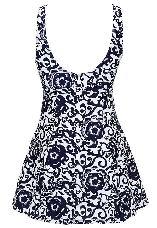 Navy floral patterned dress on a white background