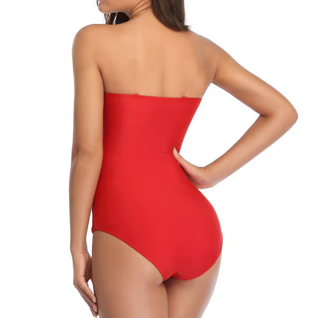 Red strapless swimsuit worn by a model on a white background