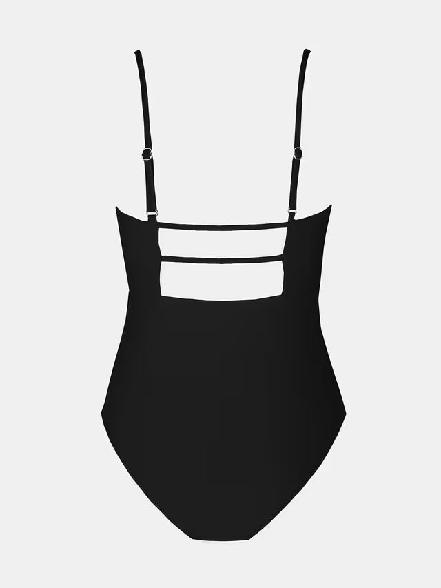 Black swimsuit with thin straps on a light gray background