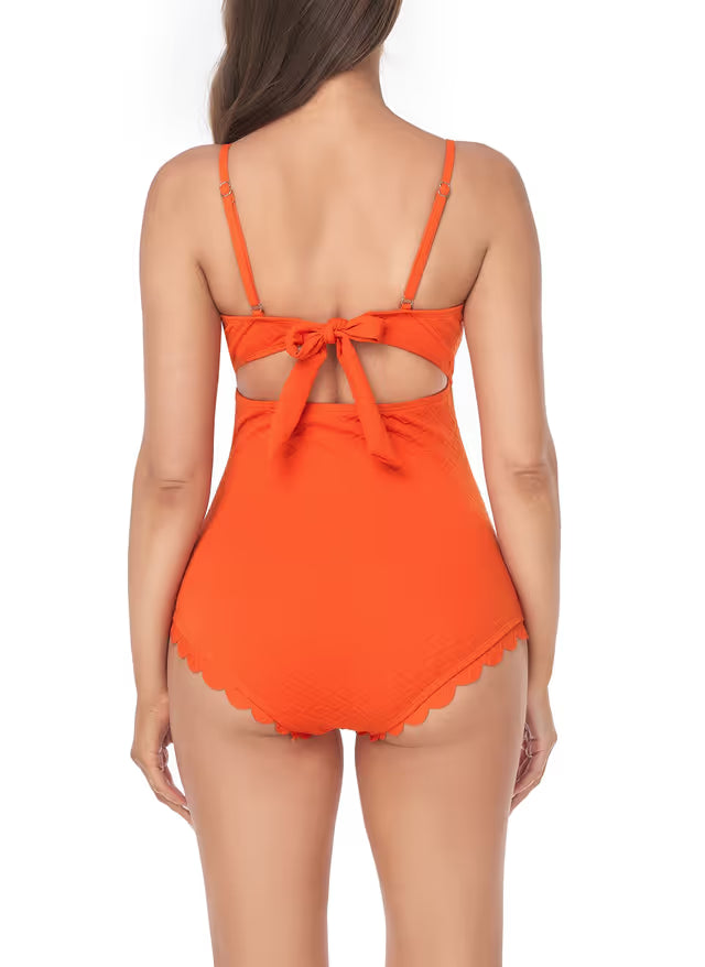 Orange swimsuit with a bow detail on a white background