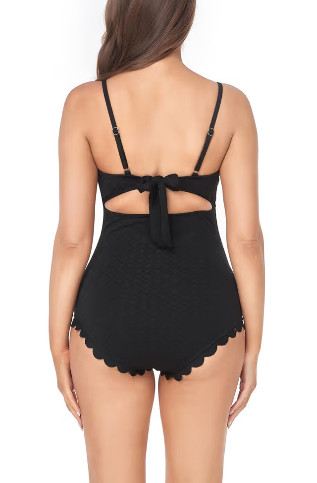 Black lace babydoll with scalloped hem on a white background