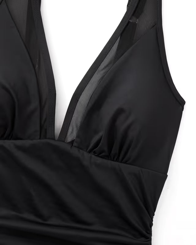 Black sleeveless top on a white background