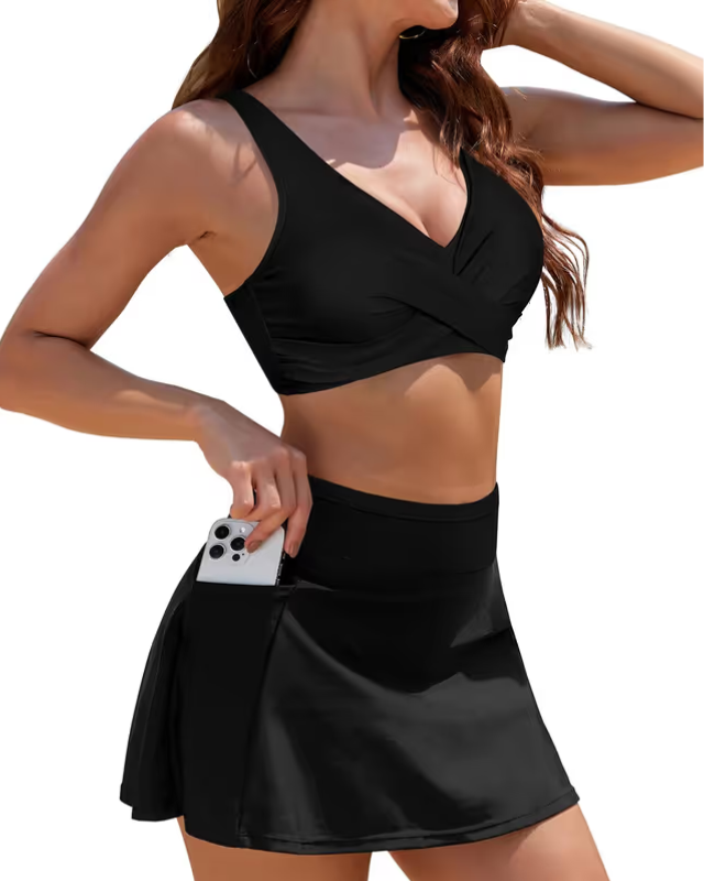 Woman in black tankini on white background