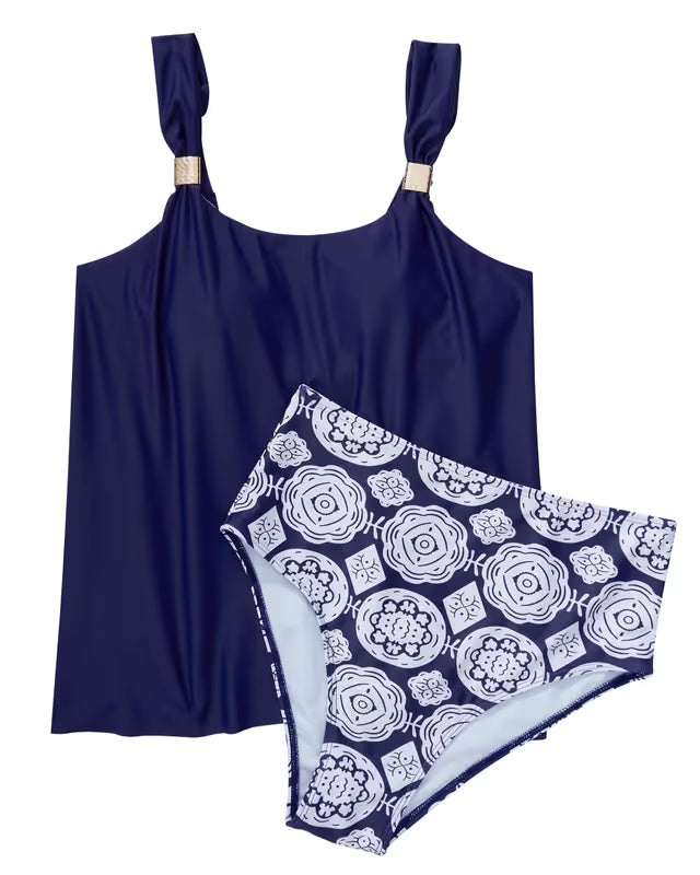 Navy blue tank top and floral patterned shorts on a white background