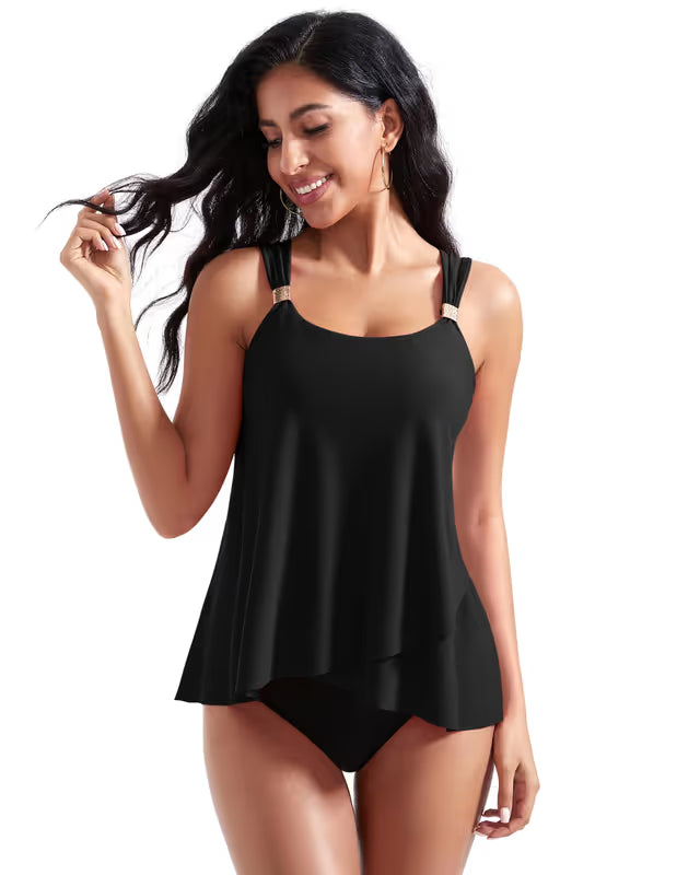 Woman wearing a black tankini set on a white background