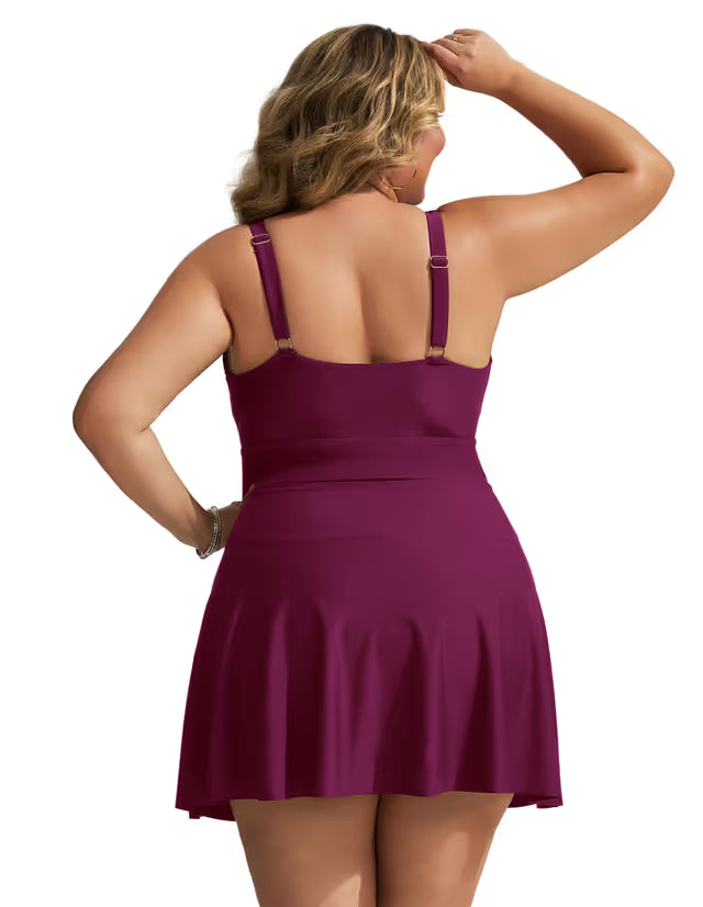 Woman in burgundy swim-dress on white background
