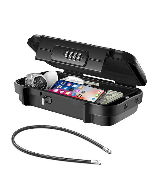 Black security combination-safe-box with a smartphone, money, and watch inside on a white background